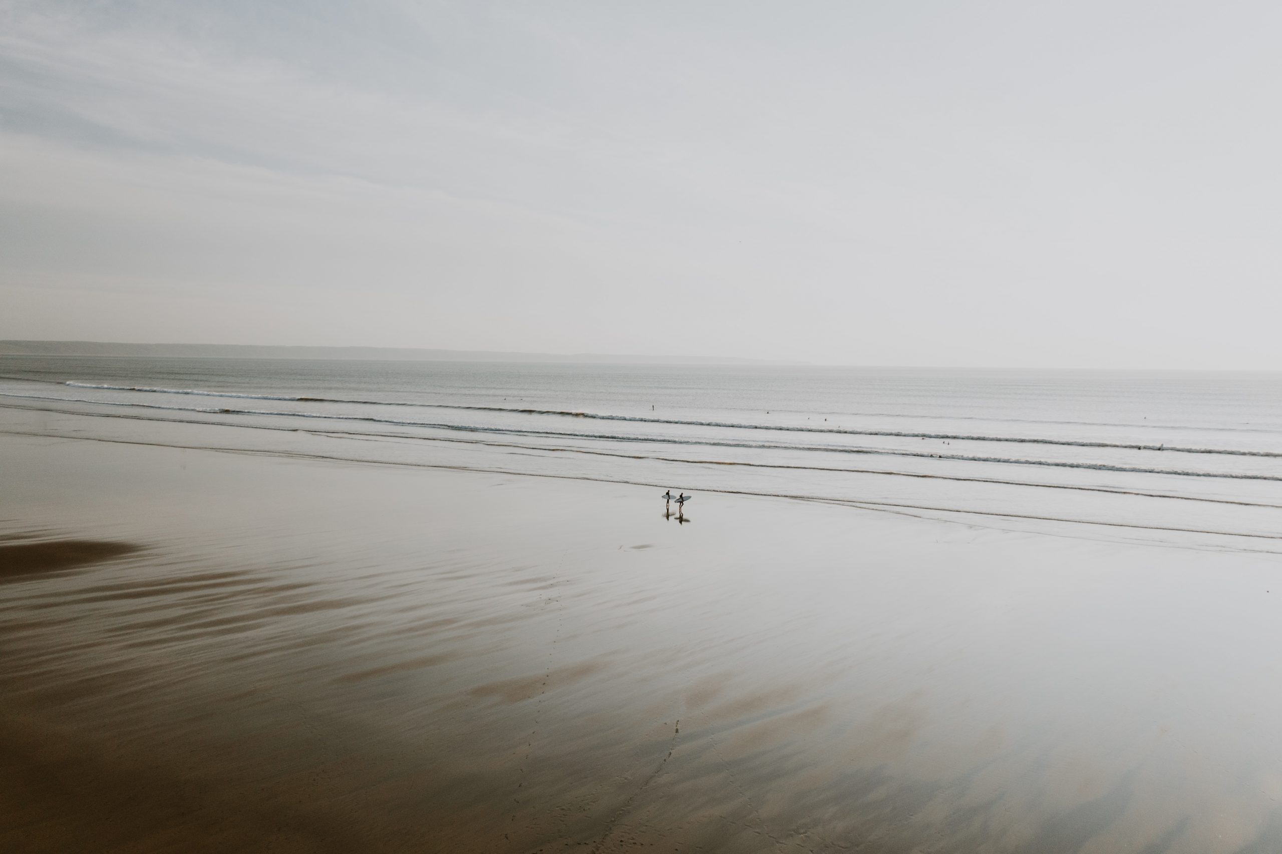 person walking on beach during daytime